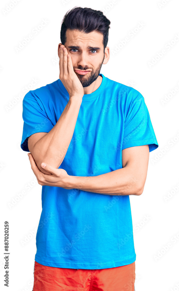 Young handsome man with beard wearing casual t-shirt thinking looking tired and bored with depression problems with crossed arms. Young handsome man with beard wearing casual t-shirt thinking looking tired and bored with depression problems with crossed arms.