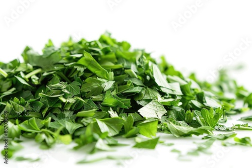 A close-up shot of a pile of parsley leaves on a white surface, perfect for food, recipe or cooking related images photo