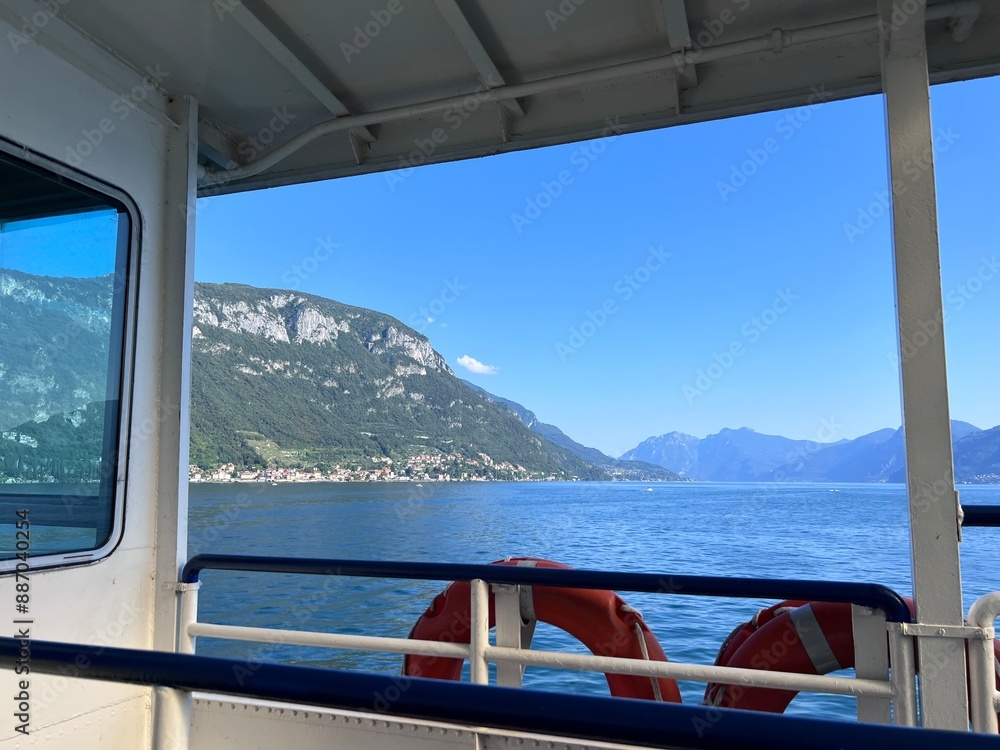 Fototapeta premium Como lake view from boat blue sky summer varenna