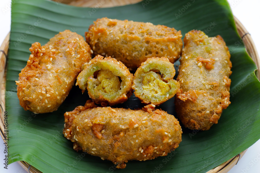 Deep-fried banana rolls with unripe rice grain Deep-fried banana rolls with unripe rice grain