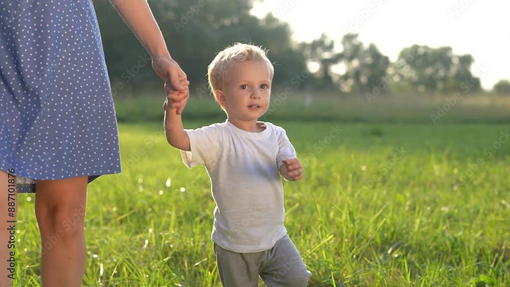mother and baby a son walking in the park. happy family walking in the park in nature relaxing outdoors. happy family kid dream concept. lifestyle mother and child walking in the park mother and baby a son walking in the park. happy family walking in the park in nature relaxing outdoors. happy family kid dream concept. lifestyle mother and child walking in the park