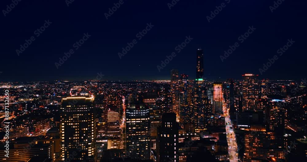 Flying above the immense panorama of luminous New York. Dazzling scenery of the city at night. Flying above the immense panorama of luminous New York. Dazzling scenery of the city at night.