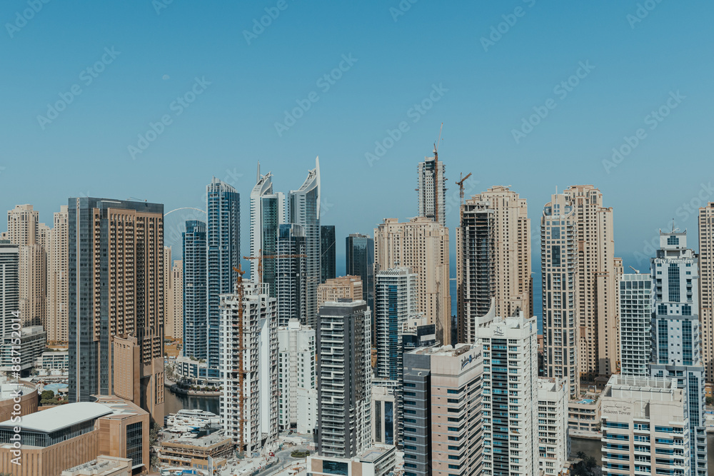 Fototapeta Stunning panoramic view of city skyline with skyscrapers and blue sky