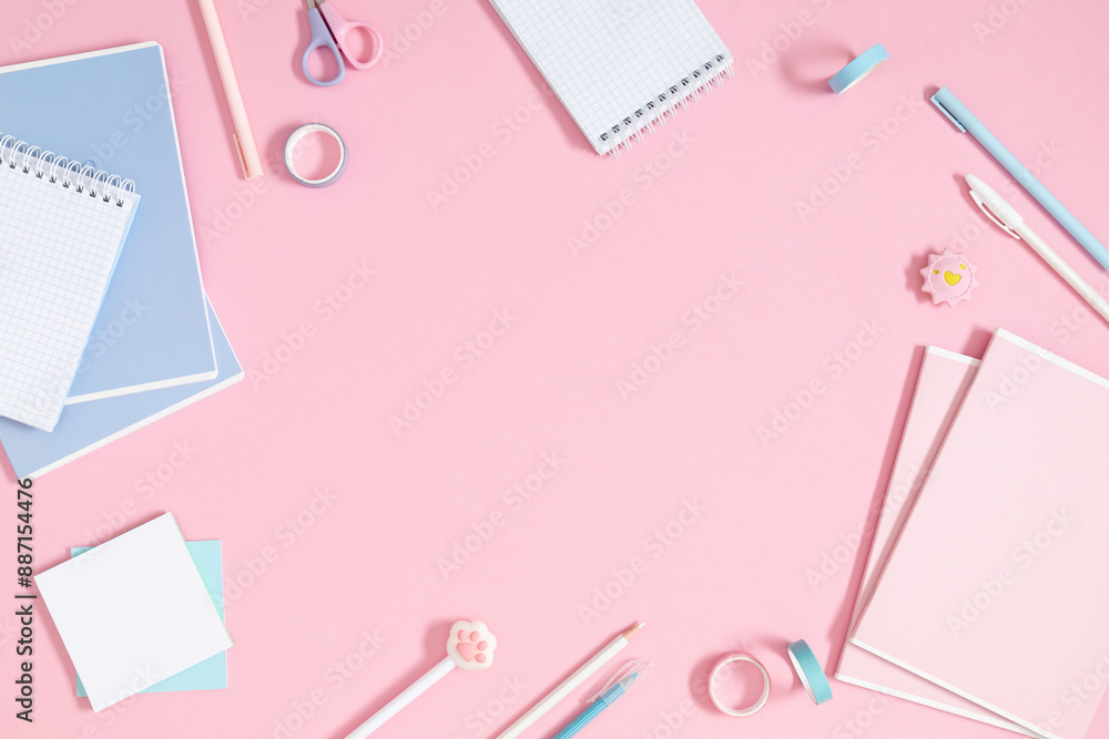 Back to school concept. Flat lay top view of stack of notepads with empty space for text, pens and pencil on isolated pastel pink background. Back to school concept. Flat lay top view of stack of notepads with empty space for text, pens and pencil on isolated pastel pink background.