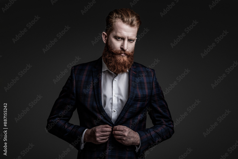 Fototapeta premium Man businessman in bespoke formalwear. Business man in elegant tailored suit. Formal tailored suit. Gentleman menswear. Bespoke suit. Bearded man in tailored formal menswear. Eveningwear ensemble