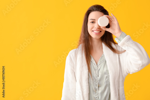 Young happy woman in pajama...