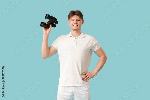 Male lifeguard with binocul...