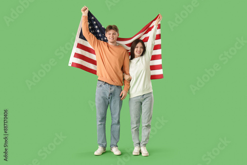 Young couple with flag of U...