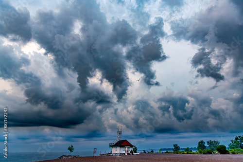 Photography storm clouds over a sand beach and lake ontario in early morning, shot kew beach