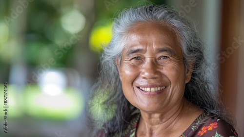 Joyful Elderly Pacific Islander Woman with Gray Hair Smiling Outdoors Perfect for Health and Happiness Campaigns