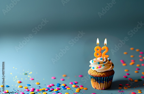 Birthday cupcake with number eighty-two candle photo