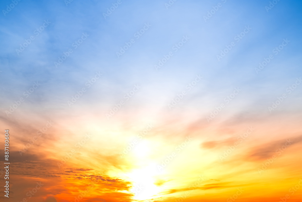 Obraz premium Beautiful , luxury soft gradient orange gold clouds and sunlight on the blue sky perfect for the background, take in everning,Twilight, Large size, high definition landscape photo