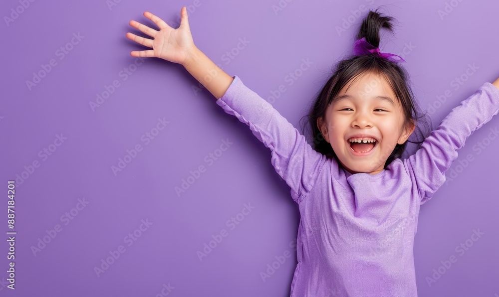 Portrait of a laughing little girl with arms outstretched. Portrait of a laughing little girl with arms outstretched.