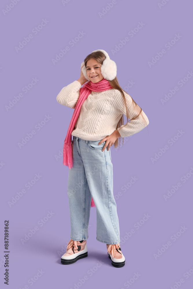 Cute little stylish happy girl in winter clothes on purple background Cute little stylish happy girl in winter clothes on purple background