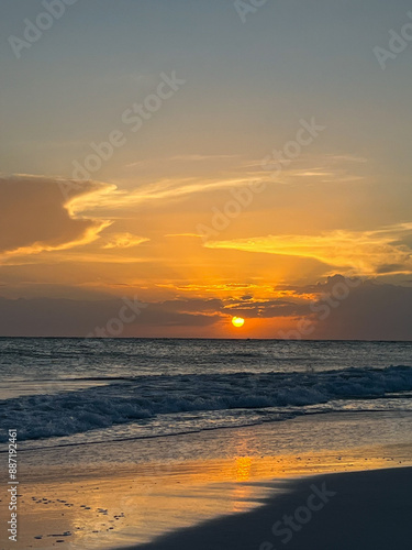 Ocean sunset on the beach in Florida with colorful skies.