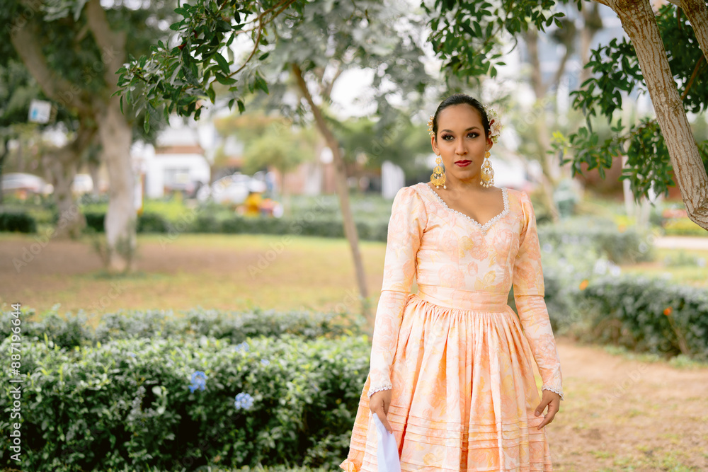 Latin dancer posing in a park wearing traditional dress Latin dancer posing in a park wearing traditional dress