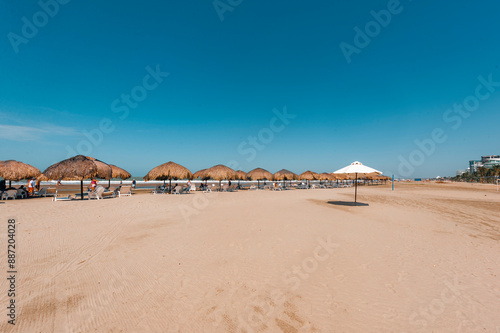 Straw umbrella on La Boquilla beach in Cartagena, Colombia