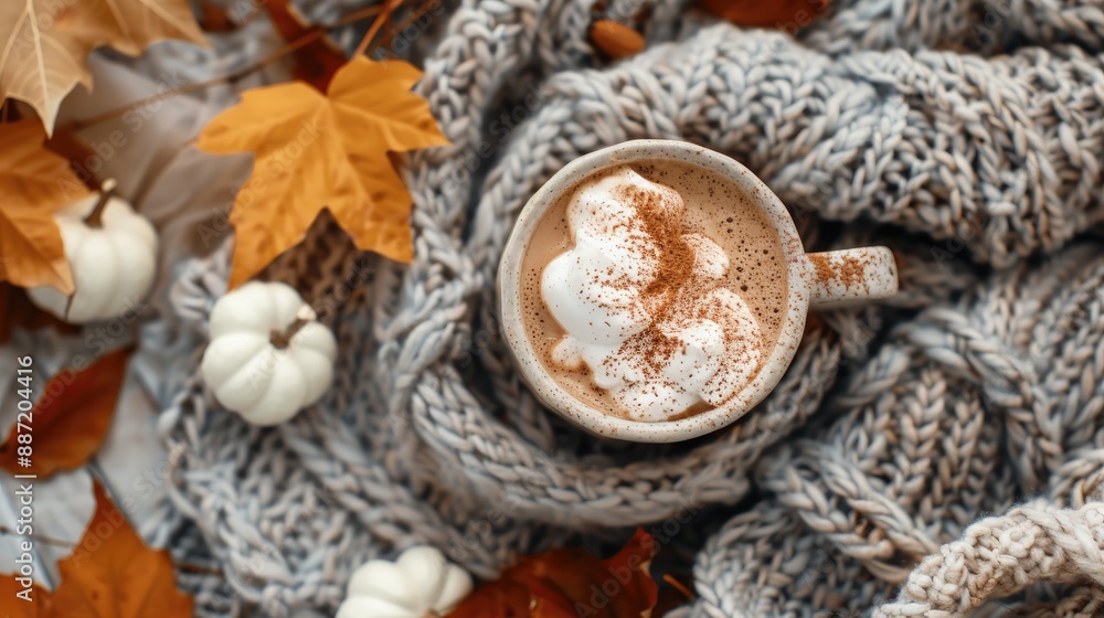 Autumn themed flat lay with hot cocoa knitted blanket and fall foliage Autumn themed flat lay with hot cocoa knitted blanket and fall foliage