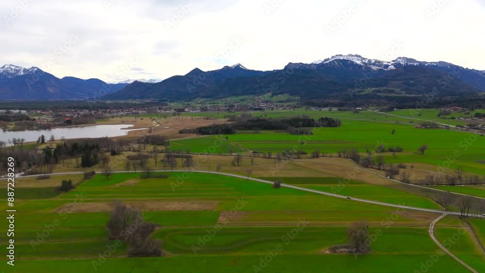 Germany, Bavaria, Aerial view Prien am Chiemsee with Chiemgau Alps in background. Das Bayerische Meer. Chiemgauer Bergen. Drone view of the largest lake in Bayern. Bernau am Chiemsee. Germany, Bavaria, Aerial view Prien am Chiemsee with Chiemgau Alps in background. Das Bayerische Meer. Chiemgauer Bergen. Drone view of the largest lake in Bayern. Bernau am Chiemsee.
