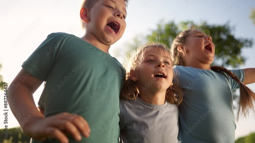 group of children jumping shouting rejoicing. happy family a kid dream concept. children in the park at the pioneer camp lifestyle. children victory jump hugging group group of children jumping shouting rejoicing. happy family a kid dream concept. children in the park at the pioneer camp lifestyle. children victory jump hugging group