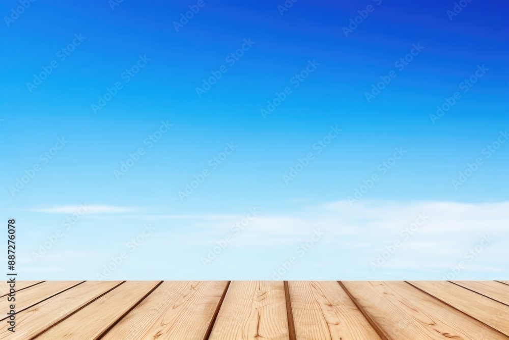 Empty wooden table top with a blue sky background Empty wooden table top with a blue sky background
