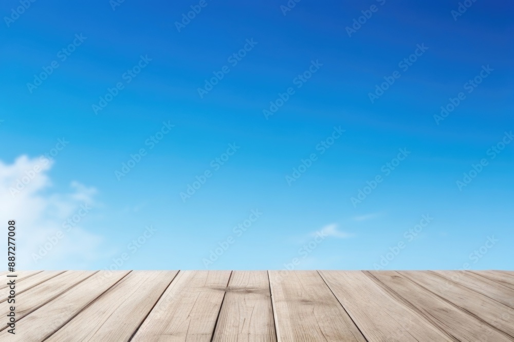 Empty wooden table top with a blue sky background Empty wooden table top with a blue sky background