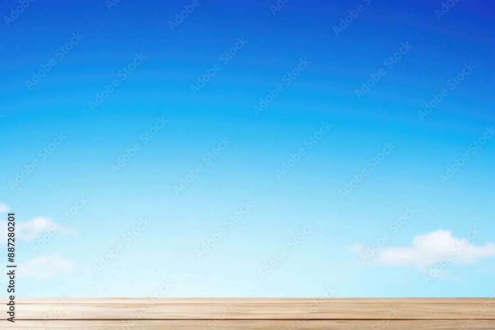Empty wooden table top with a blue sky background Empty wooden table top with a blue sky background