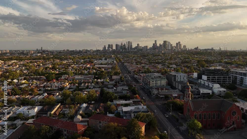 Low aerial view of the Brunswick area of the city of Melbourne, skyscrapers in the background. Low aerial view of the Brunswick area of the city of Melbourne, skyscrapers in the background.