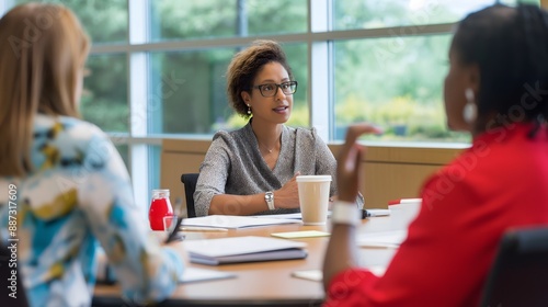 - A nonprofit manager leading a meeting with staff, with a focus on collaboration and leadership