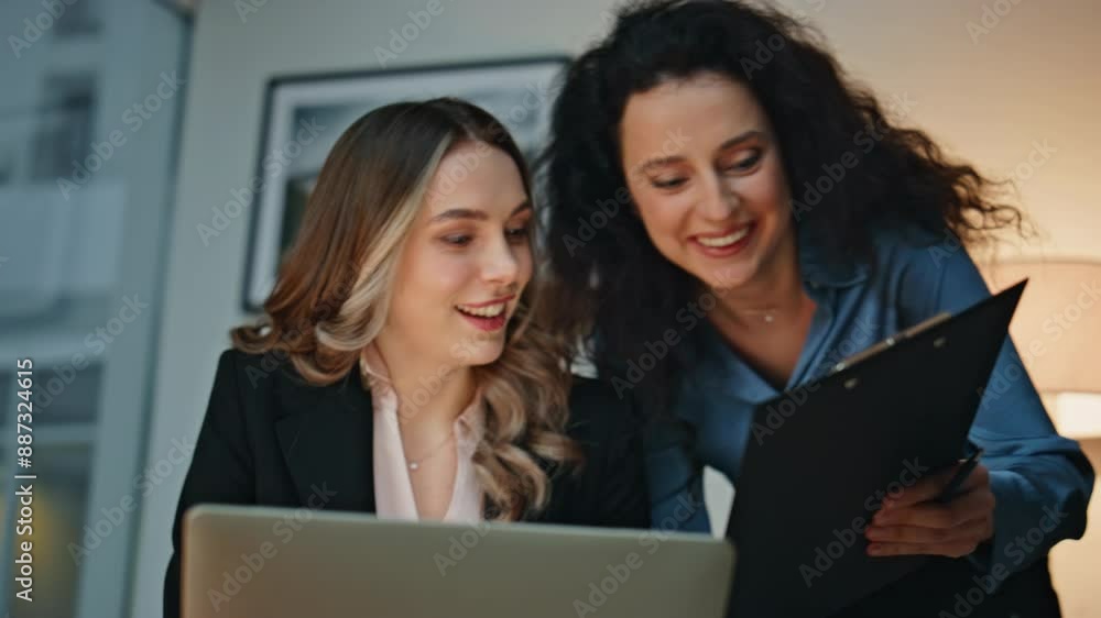 Professional women discuss project at modern office. Closeup business colleagues Professional women discuss project at modern office. Closeup business colleagues