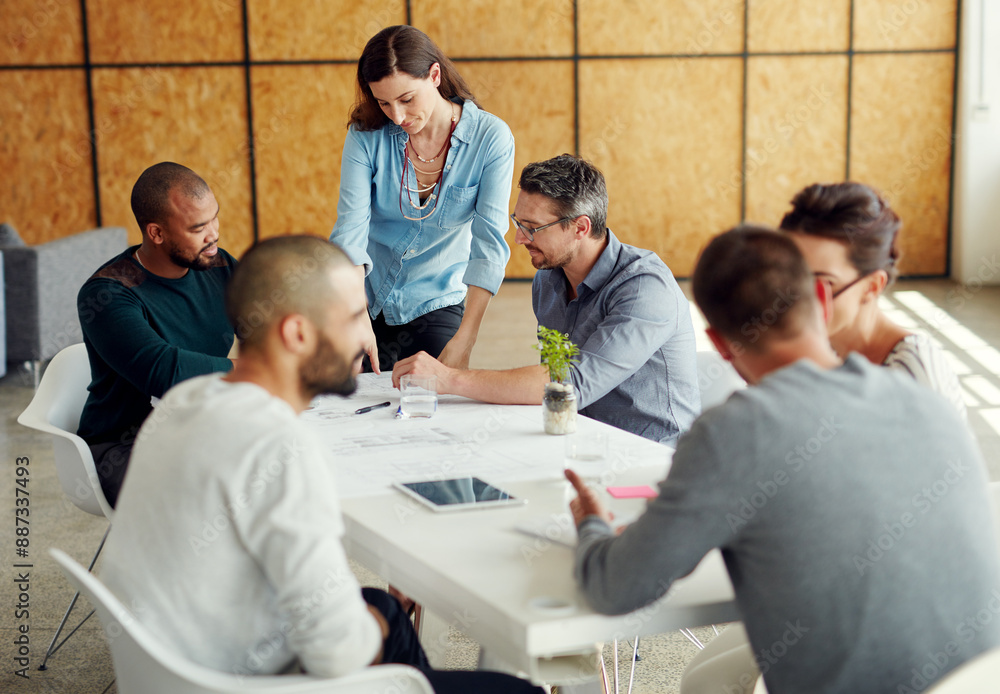 Making tomorrows success today. Shot of a group of coworkers having a meeting in an open plan office. Making tomorrows success today. Shot of a group of coworkers having a meeting in an open plan office.