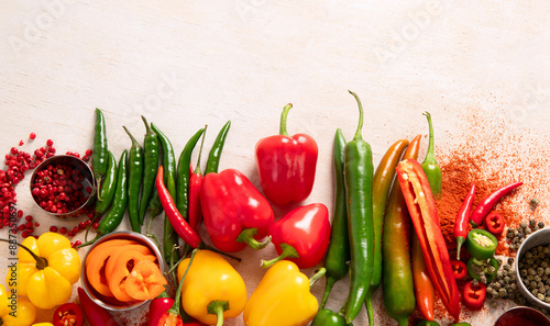 Peppers assorty on wooden background. Tasty vegetables. Colorful organic food. photo