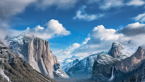 wallpaper high cliffs and mountains with snow on tops against a blue sky and clouds