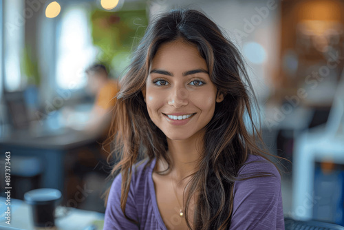 Confident Indian Woman in Purple Shirt at Home Office Smiling with Laptop and Coffee Cup