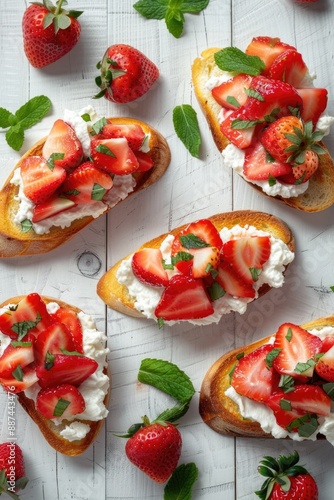 Fresh strawberries and cream on toasted bread with mint leaves, perfect for a sweet snack or dessert