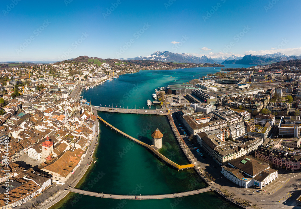 Φωτογραφία Lucerne, Switzerland: Aerial drone view of the Reuss river in Lucerne old town with the famous Chapel wooden bridge before reaching lake Lucerne in Switzerland