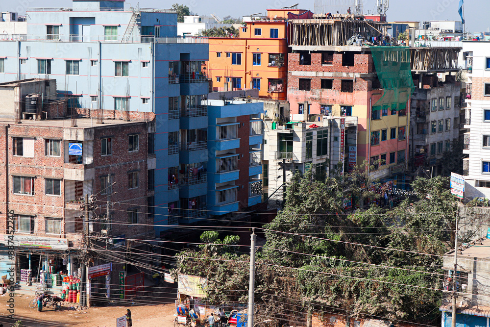 Fototapeta premium Colorful Urban Residential Area with People Engaged in Daily Activities and Construction Work under Clear Blue Sky