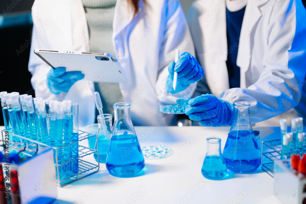 Fototapeta premium Scientist team meeting and writing analysis results in the laboratory study and analyze scientific