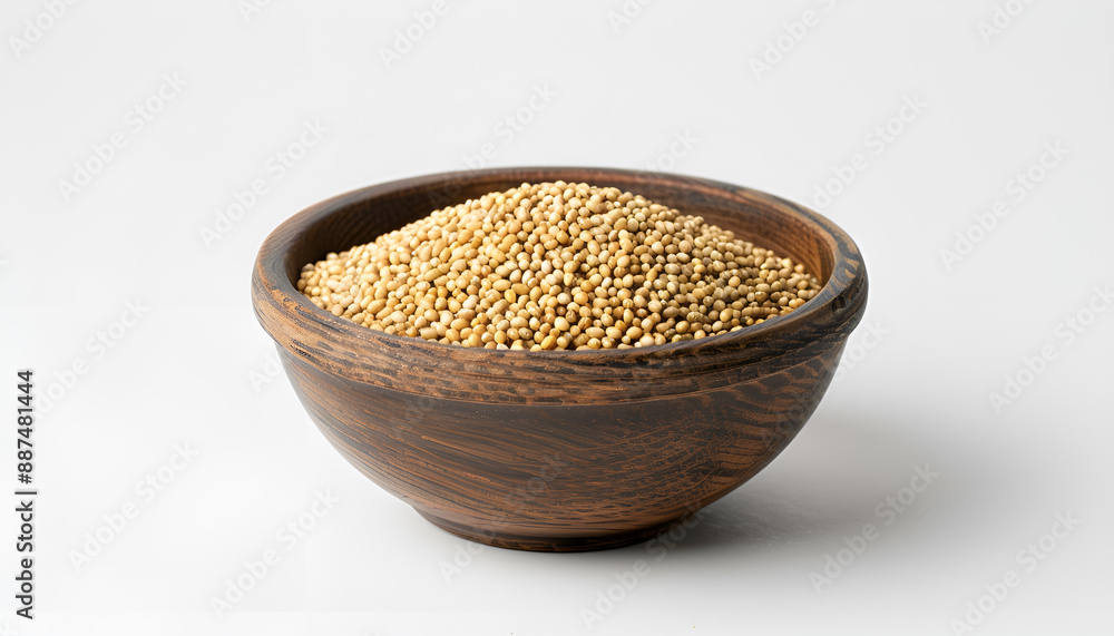 Dry millet seeds in bowl isolated on white Dry millet seeds in bowl isolated on white