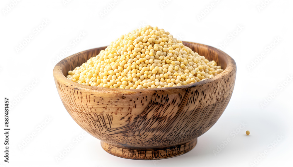 Dry millet seeds in bowl isolated on white Dry millet seeds in bowl isolated on white