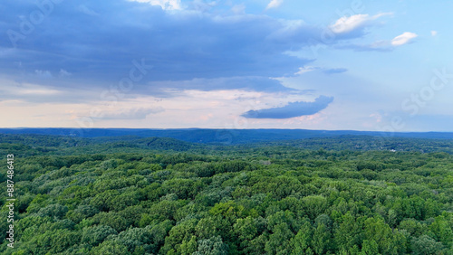 Obraz na plátně Stormy Drone photo above the green forest in rural Connecticut