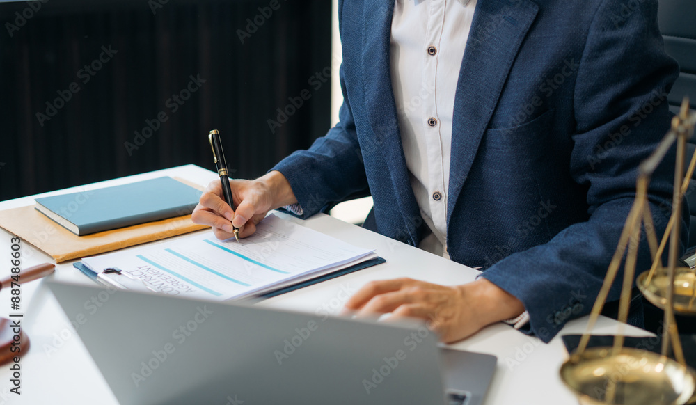 Serious pensive lawyer working at desk in office. Serious pensive lawyer working at desk in office.