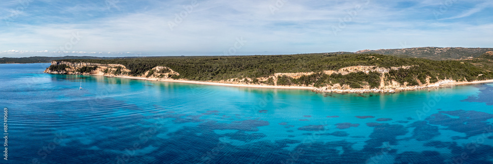 Panoramic aerial view of the Plage de Vo'lpe and the translucent turquoise Mediterranean sea on the south east coast of the island of Corsica Panoramic aerial view of the Plage de Vo'lpe and the translucent turquoise Mediterranean sea on the south east coast of the island of Corsica