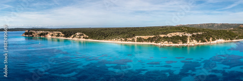 Panoramic aerial view of the Plage de Vo'lpe and the translucent turquoise Mediterranean sea on the south east coast of the island of Corsica © Jon Ingall