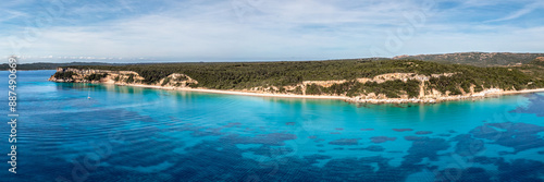 Panoramic aerial view of the Plage de Vo'lpe and the translucent turquoise Mediterranean sea on the south east coast of the island of Corsica