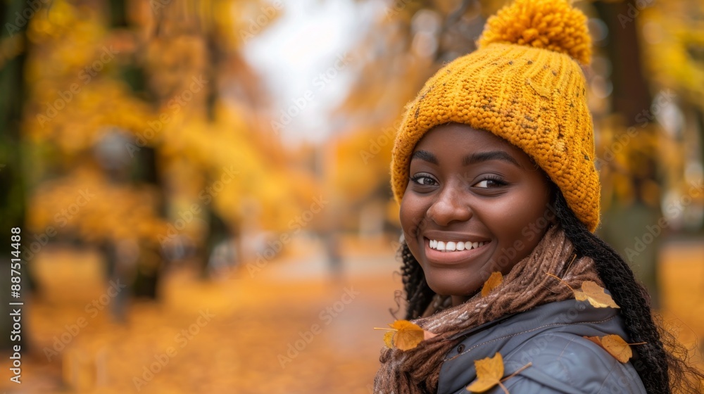 African American woman smiling in autumn forest. Concept of joy, fall season, outdoor happiness, nature.. Copy space African American woman smiling in autumn forest. Concept of joy, fall season, outdoor happiness, nature.. Copy space