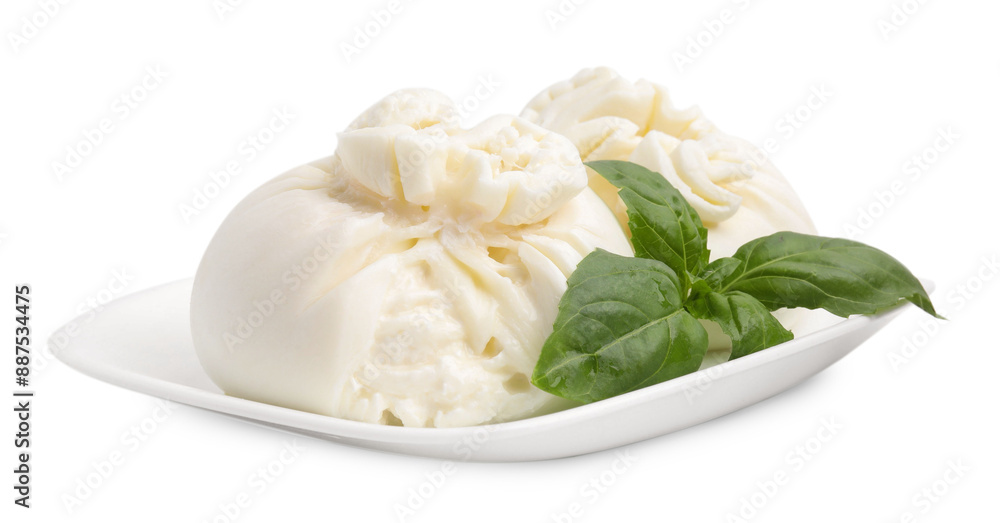Delicious burrata cheese and basil isolated on white Delicious burrata cheese and basil isolated on white