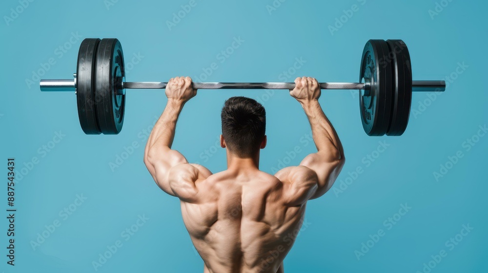 Strong man lifting heavy weights in the gym. Muscular guy doing barbell exercises for strength training. Strong man lifting heavy weights in the gym. Muscular guy doing barbell exercises for strength training.