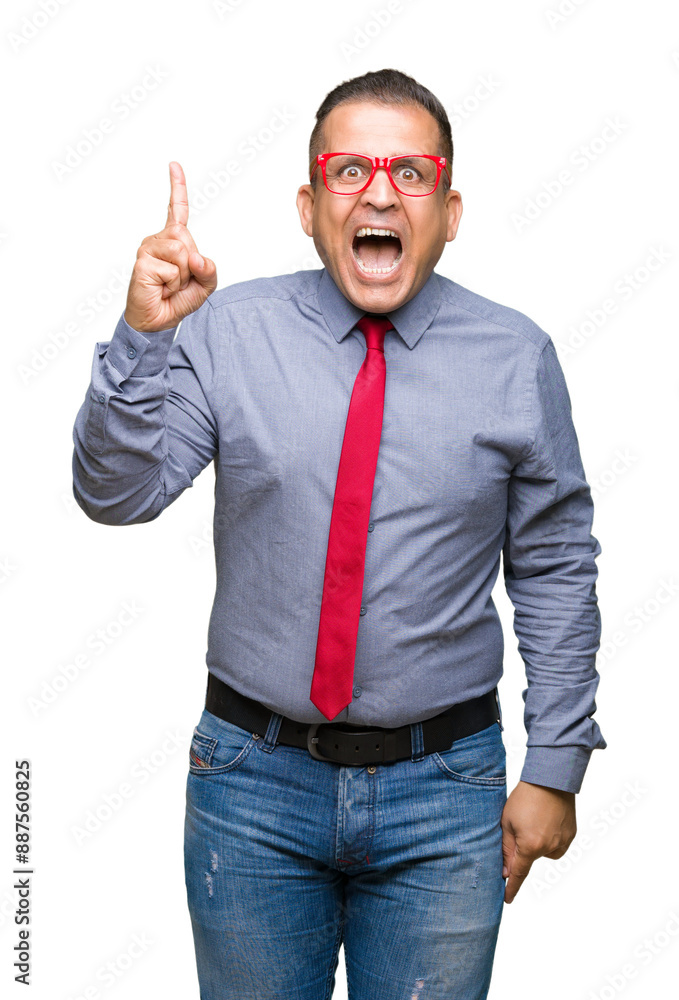 Middle age arab man wearing fashion red glasses over isolated background pointing finger up with successful idea. Exited and happy. Number one. Middle age arab man wearing fashion red glasses over isolated background pointing finger up with successful idea. Exited and happy. Number one.