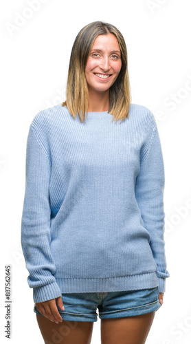 Young beautiful woman wearing winter sweater over isolated background looking away to side with smile on face, natural expression. Laughing confident.